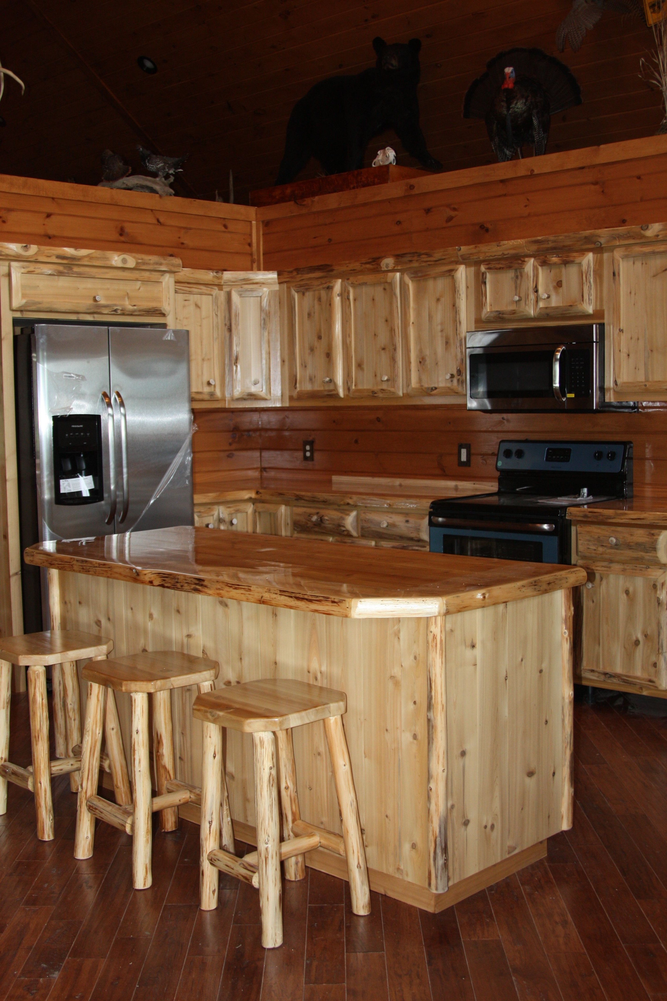 Hand crafted custom rustic cedar kitchen cabinets by king