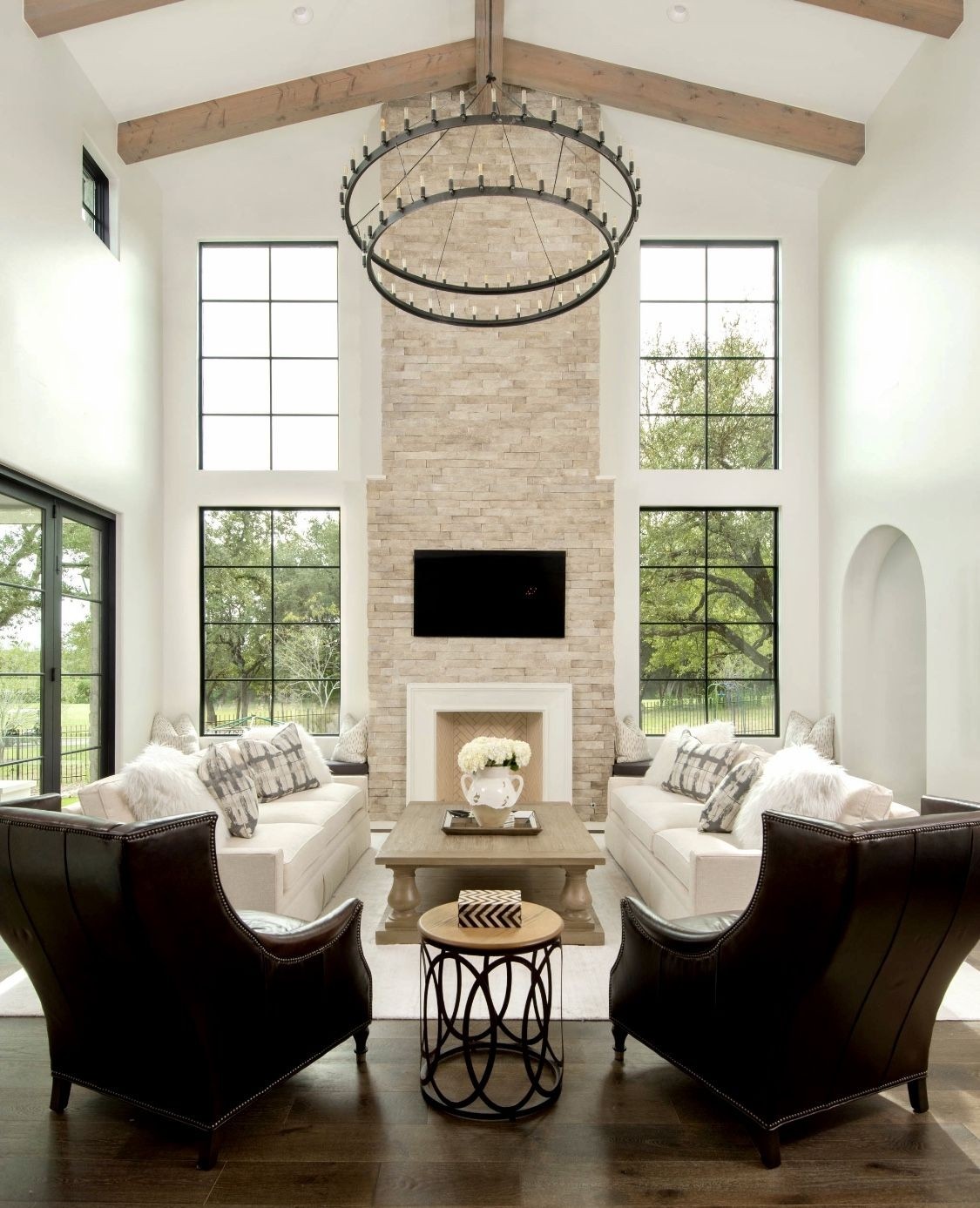 Mediterranean style living room decor with wingback chairs