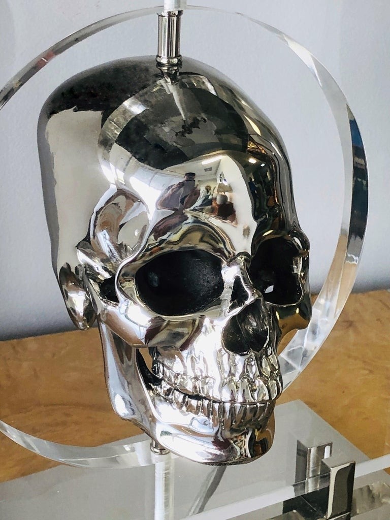 Pair of lucite and stainless steel modern skull table