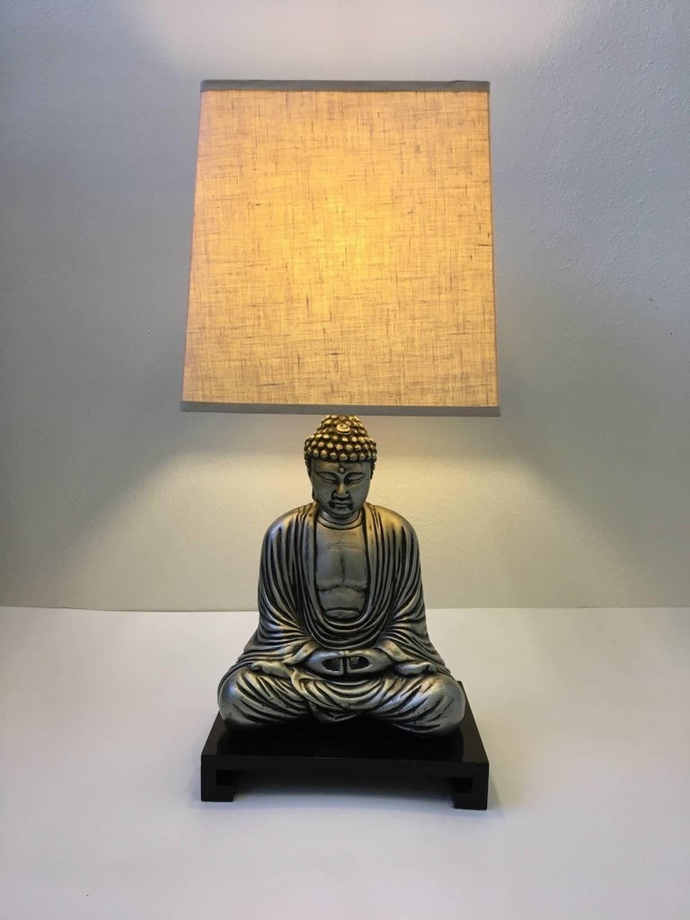 Silver and black lacquered buddha table lamp in the style