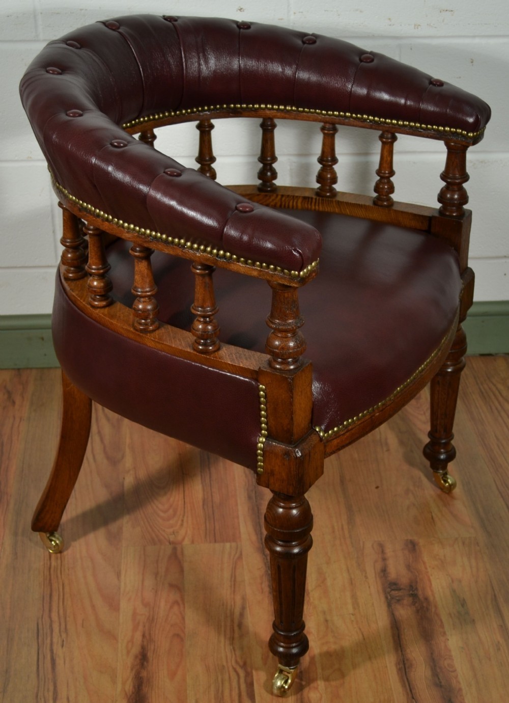 Victorian oak captains chair with antique burgundy leather