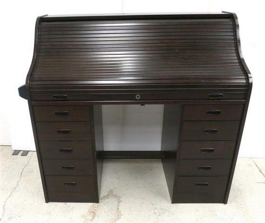 A black timber stained roll top desk five drawers to