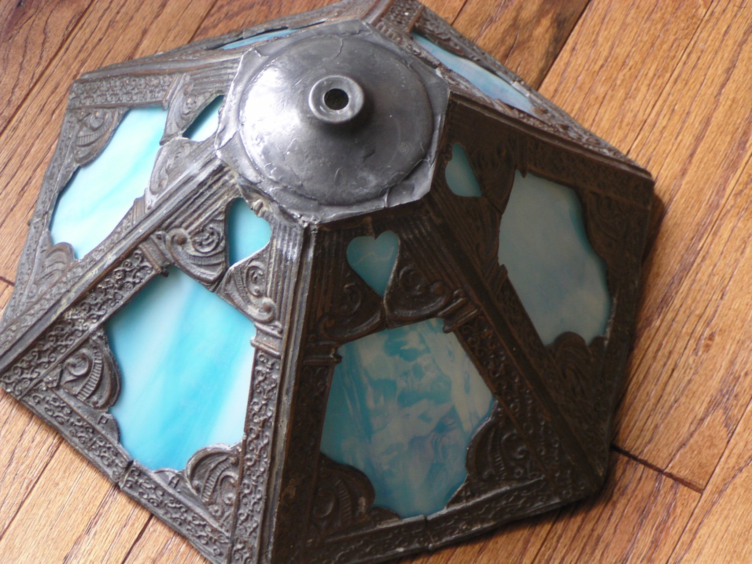 Antique blue slag glass lamp shade overlaid with teroca metal