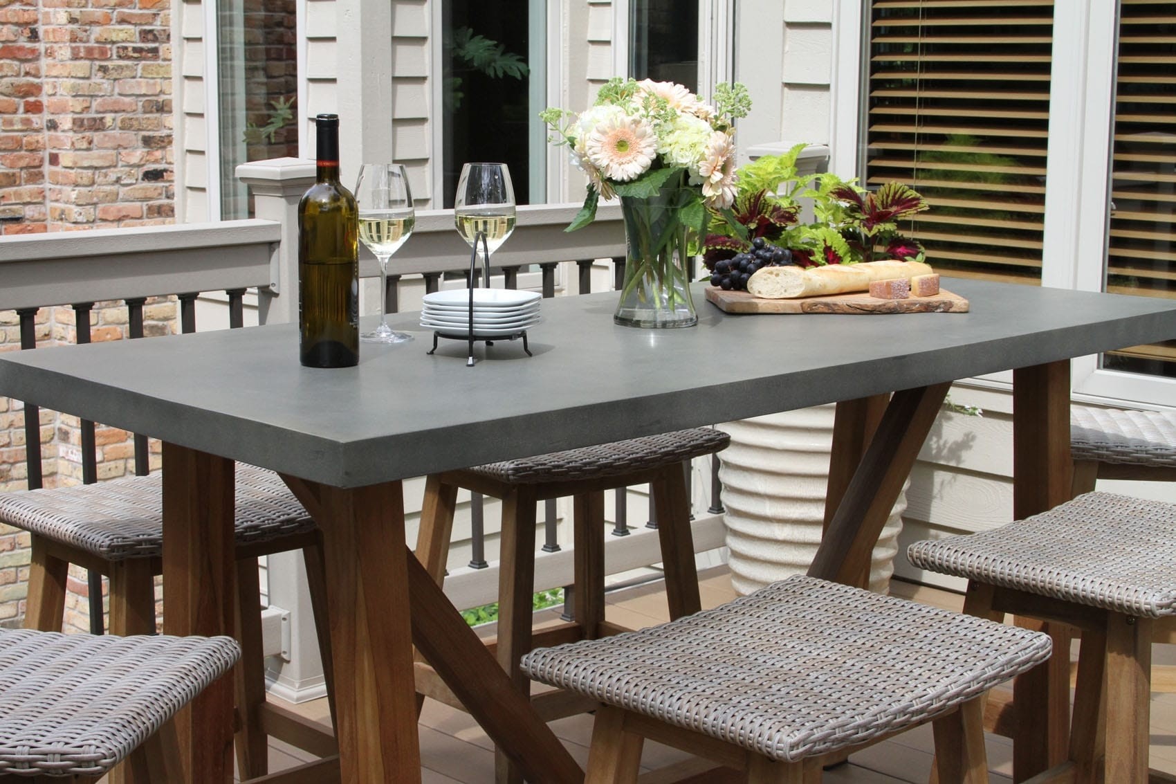 Composite counter height dining table with teak base
