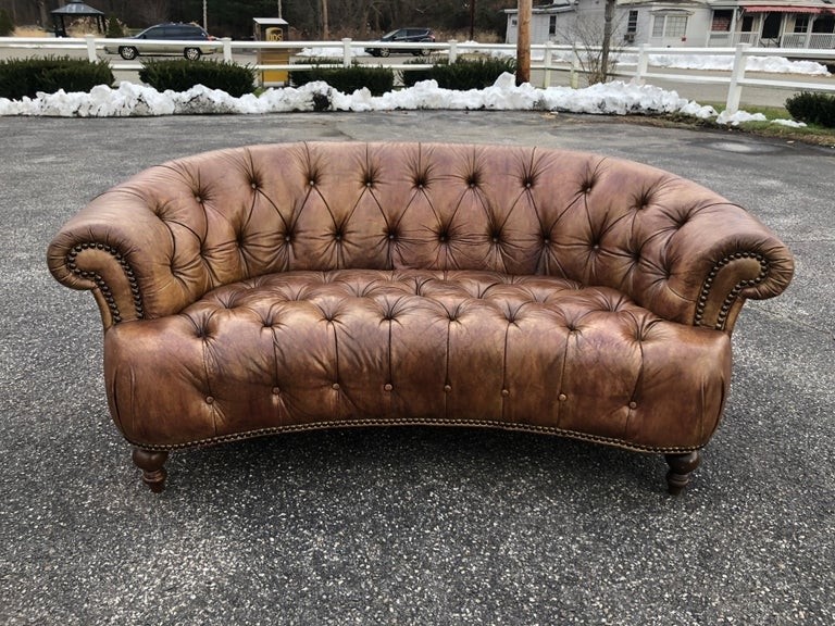 Curved light brown italian leather chesterfield sofa at 1