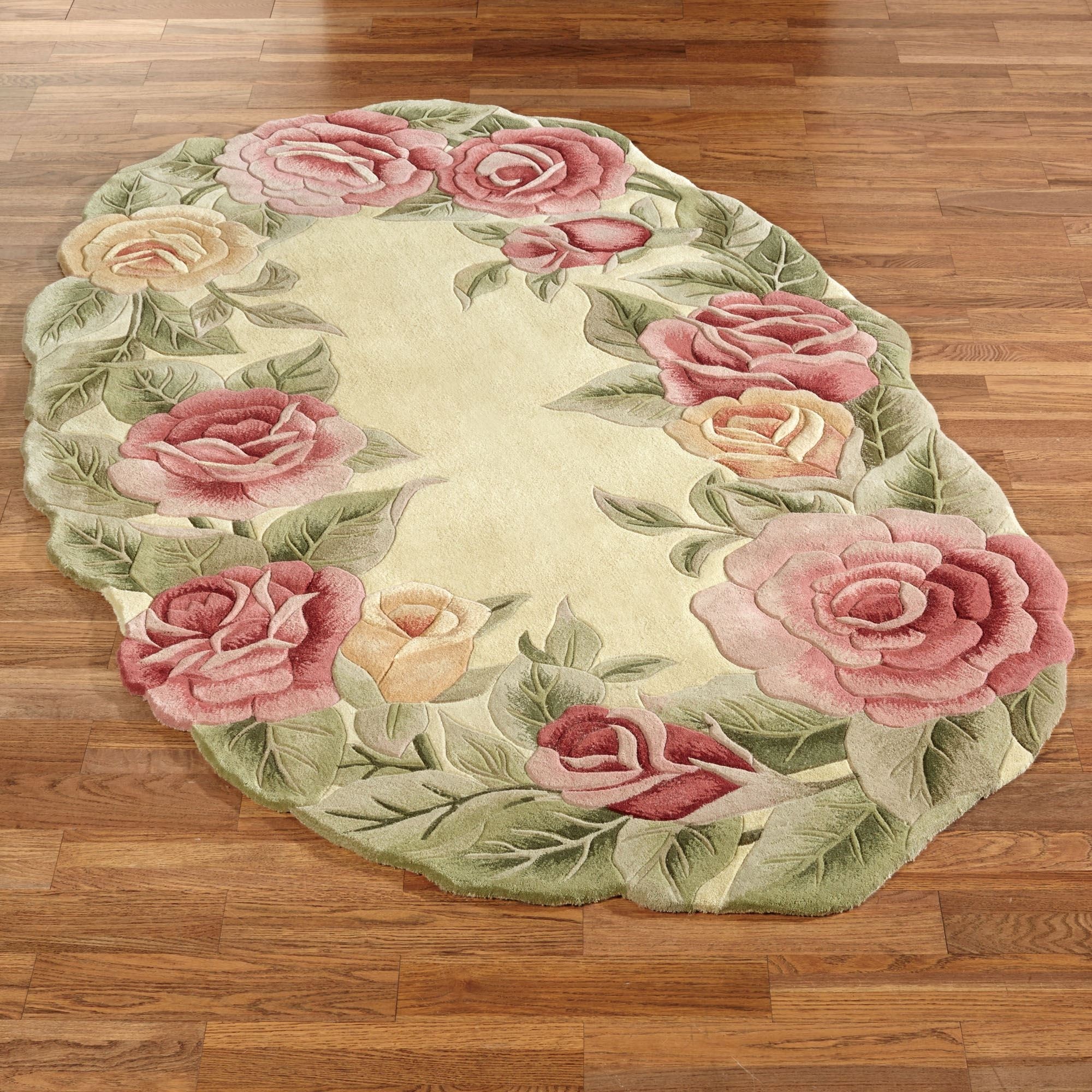 Floral roses oval area rug on hardwood floor