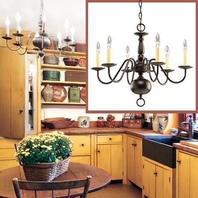 Six light chandelier create a shaker style kitchen