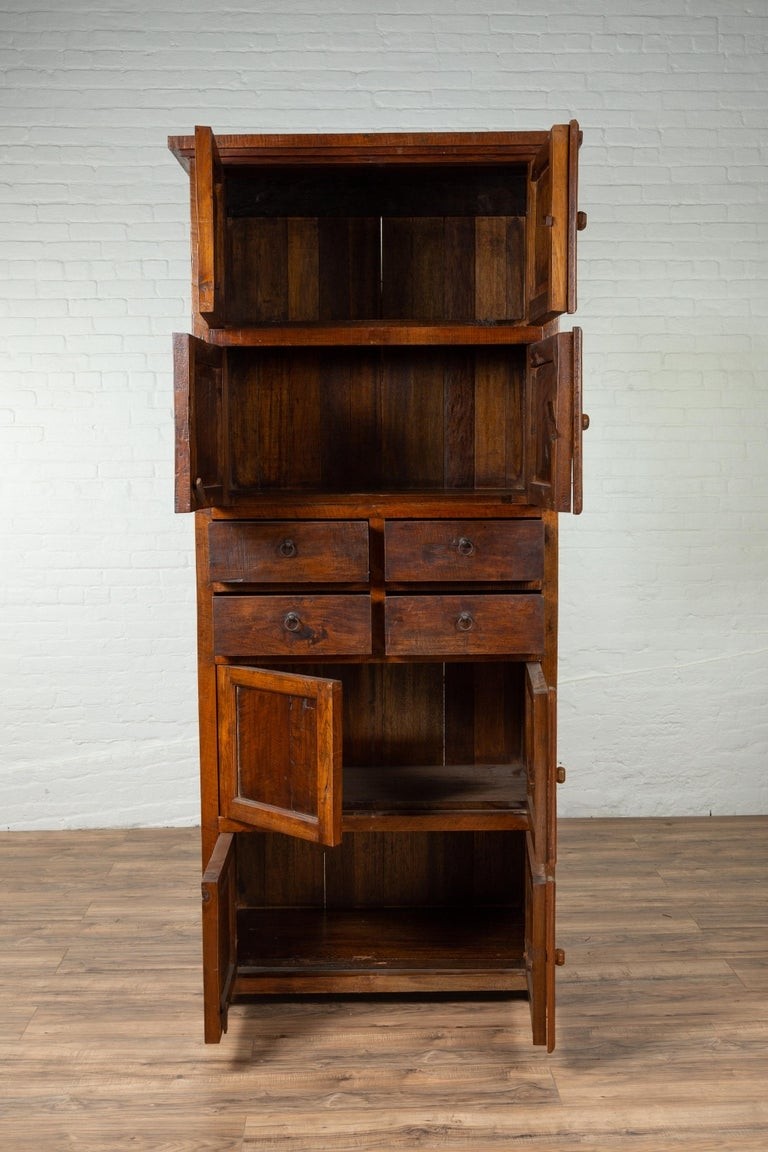 Tall antique javanese teak wood cabinet with four double