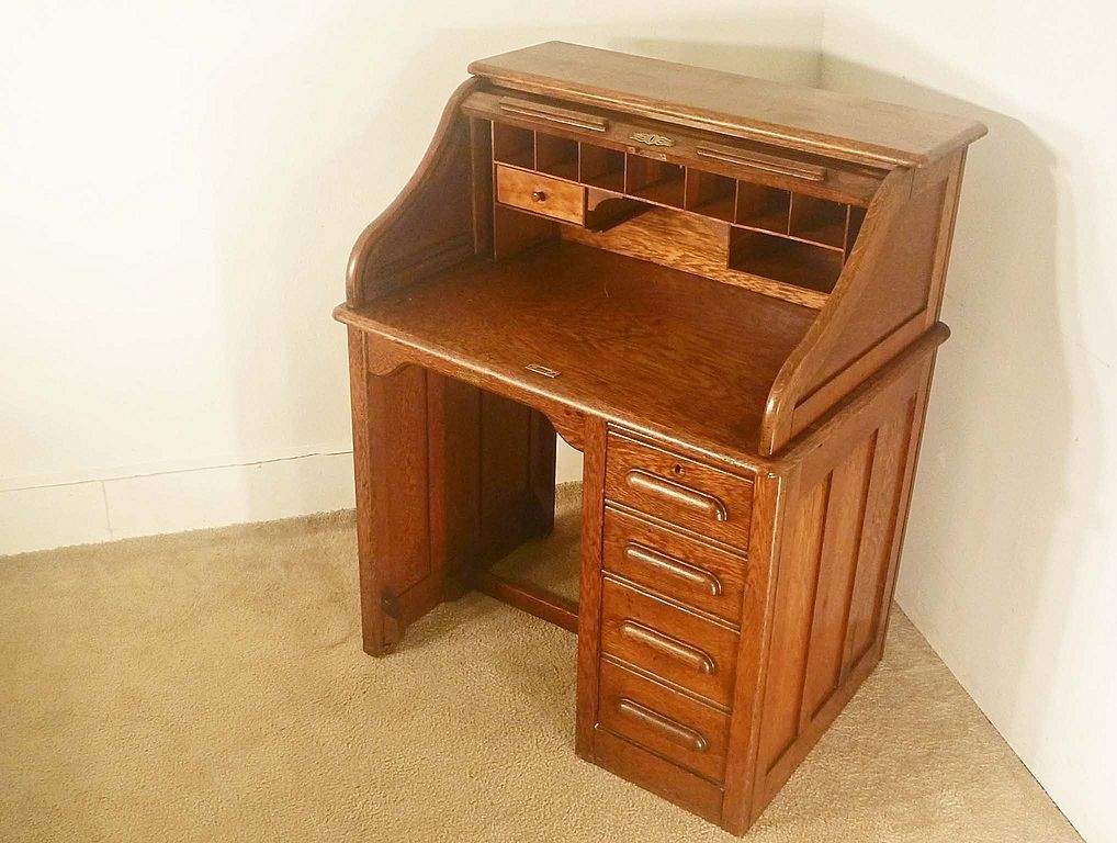 A cute little roll top desk with file drawer perfect