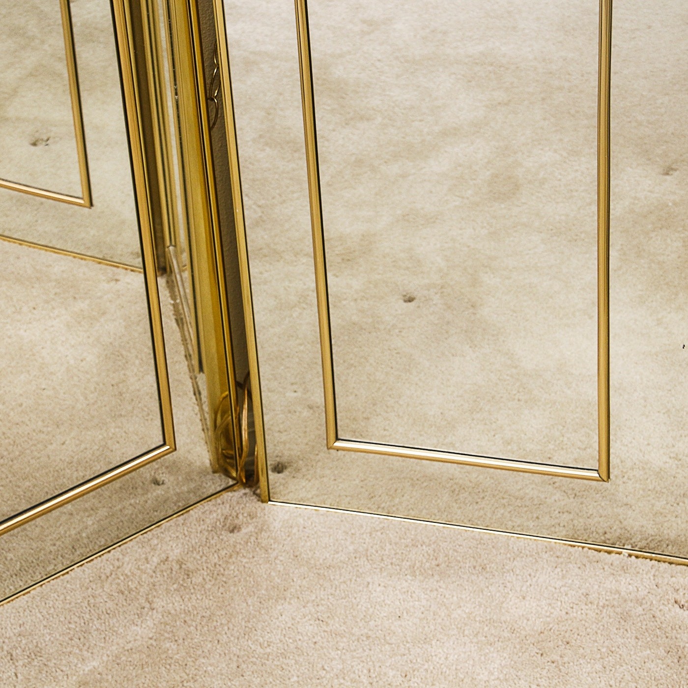 Three paneled mirrored room divider with brass accents ebth