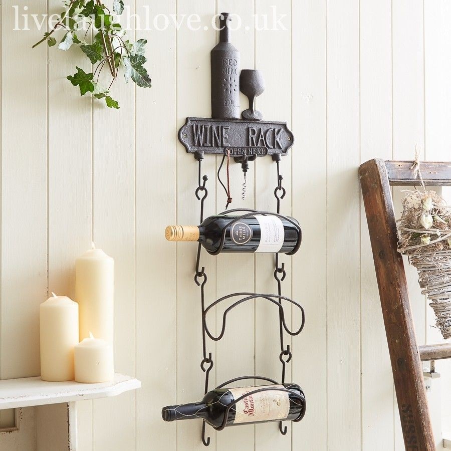 Cast iron hanging wine rack with corkscrew hanging wine
