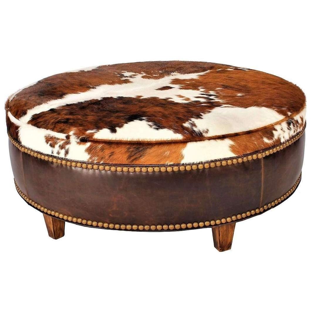Cowhide upholstered round ottoman your western decor