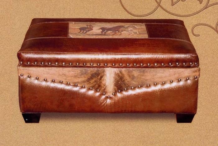 Leather ottoman with western motif and hinged lid uncovers