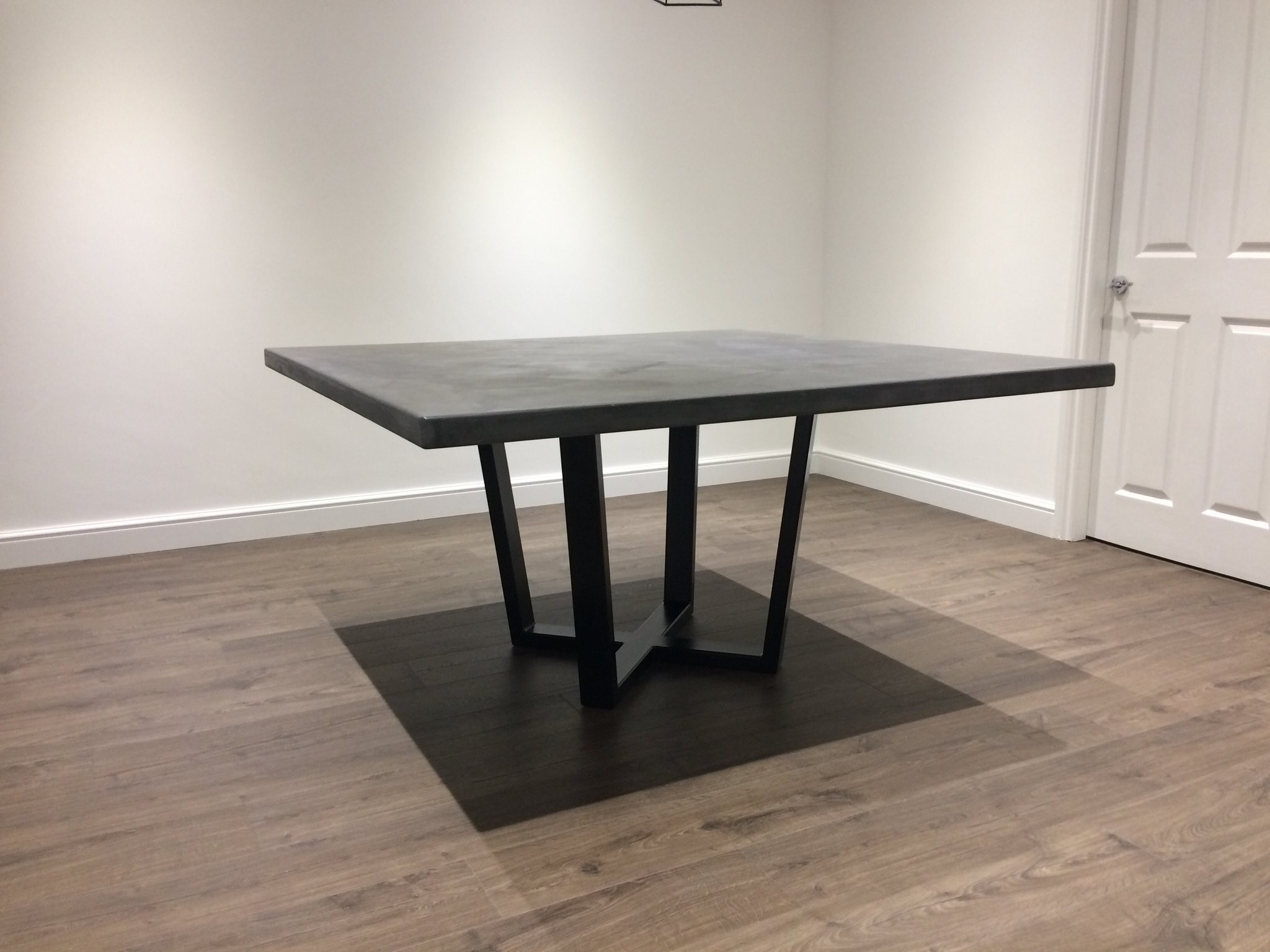 Mid grey polished concrete square dining table with steel