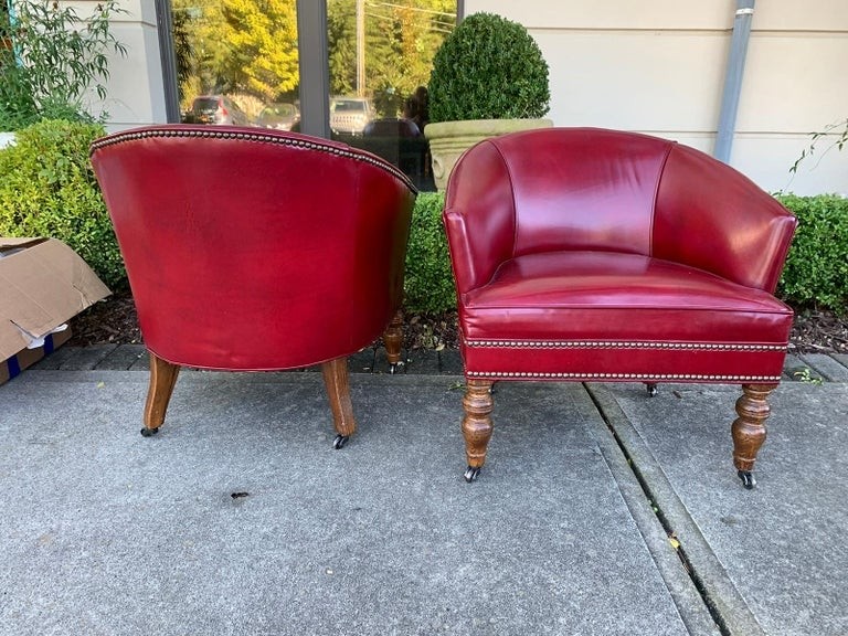 Pair of 20th century english red leather barrel chairs for