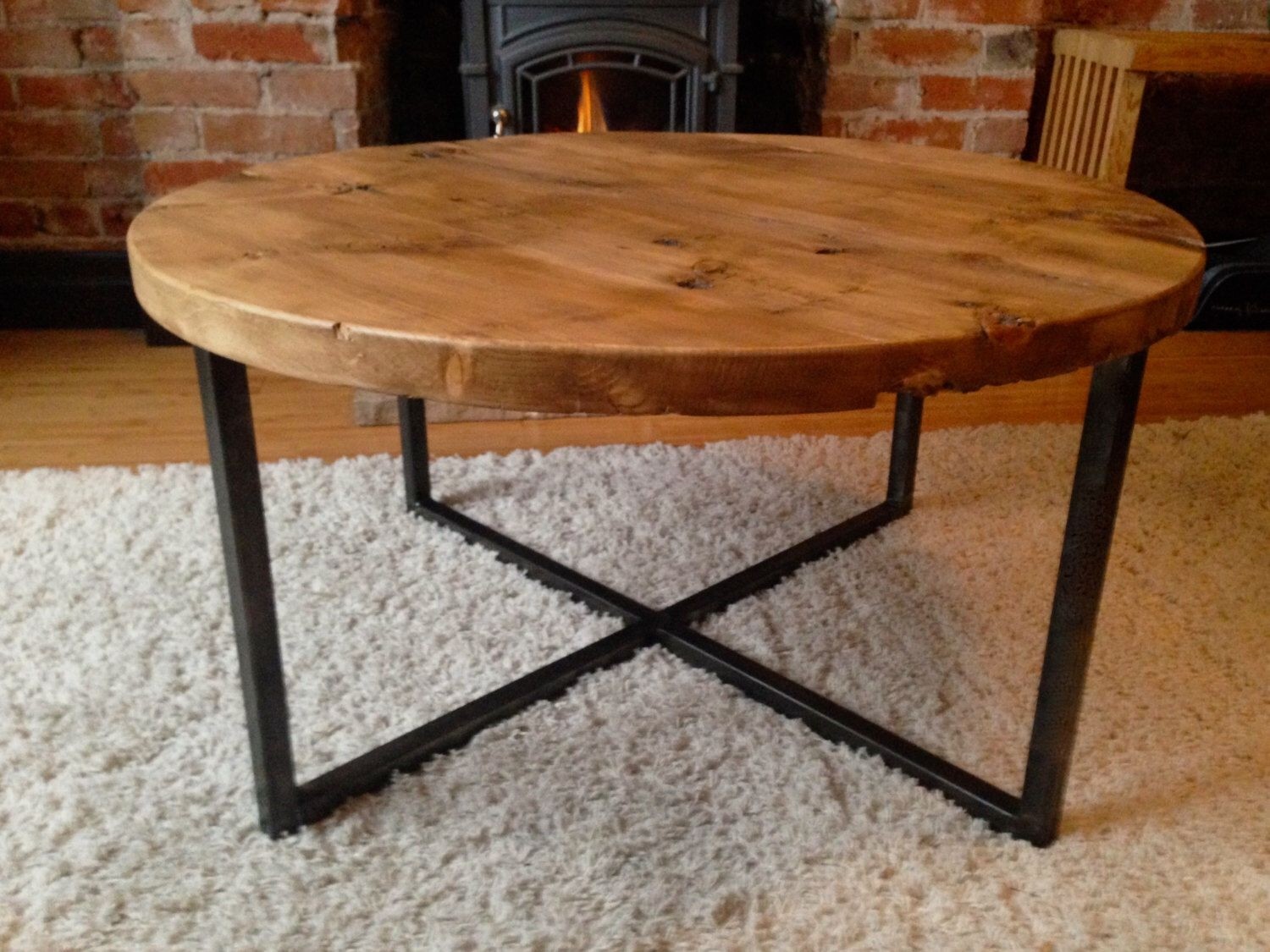 Reclaimed barn wood round coffee table with metal base