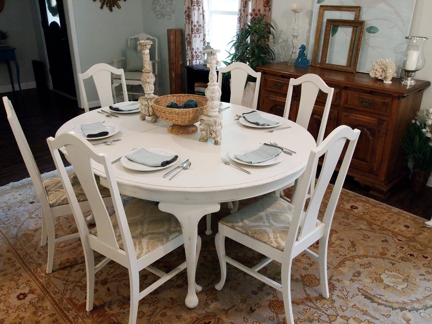 White round distressed dining table with 6 queen anne chairs