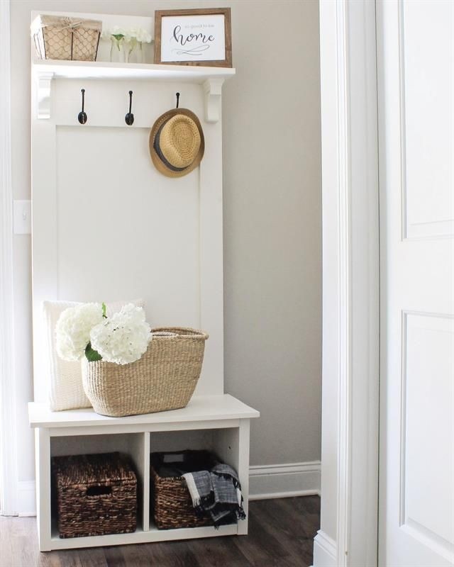 An entryway hall tree bench that is perfect for providing