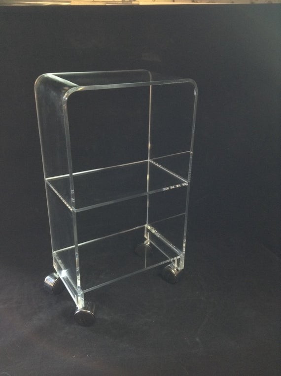 Items similar to clear acrylic rolling 3 shelf bookcase