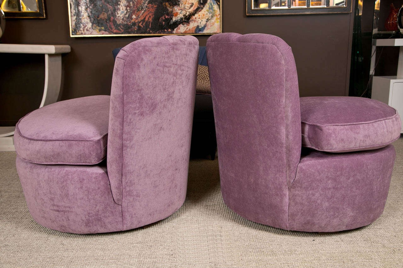 Pair of 1940s swivel lounge chairs upholstered in purple 3