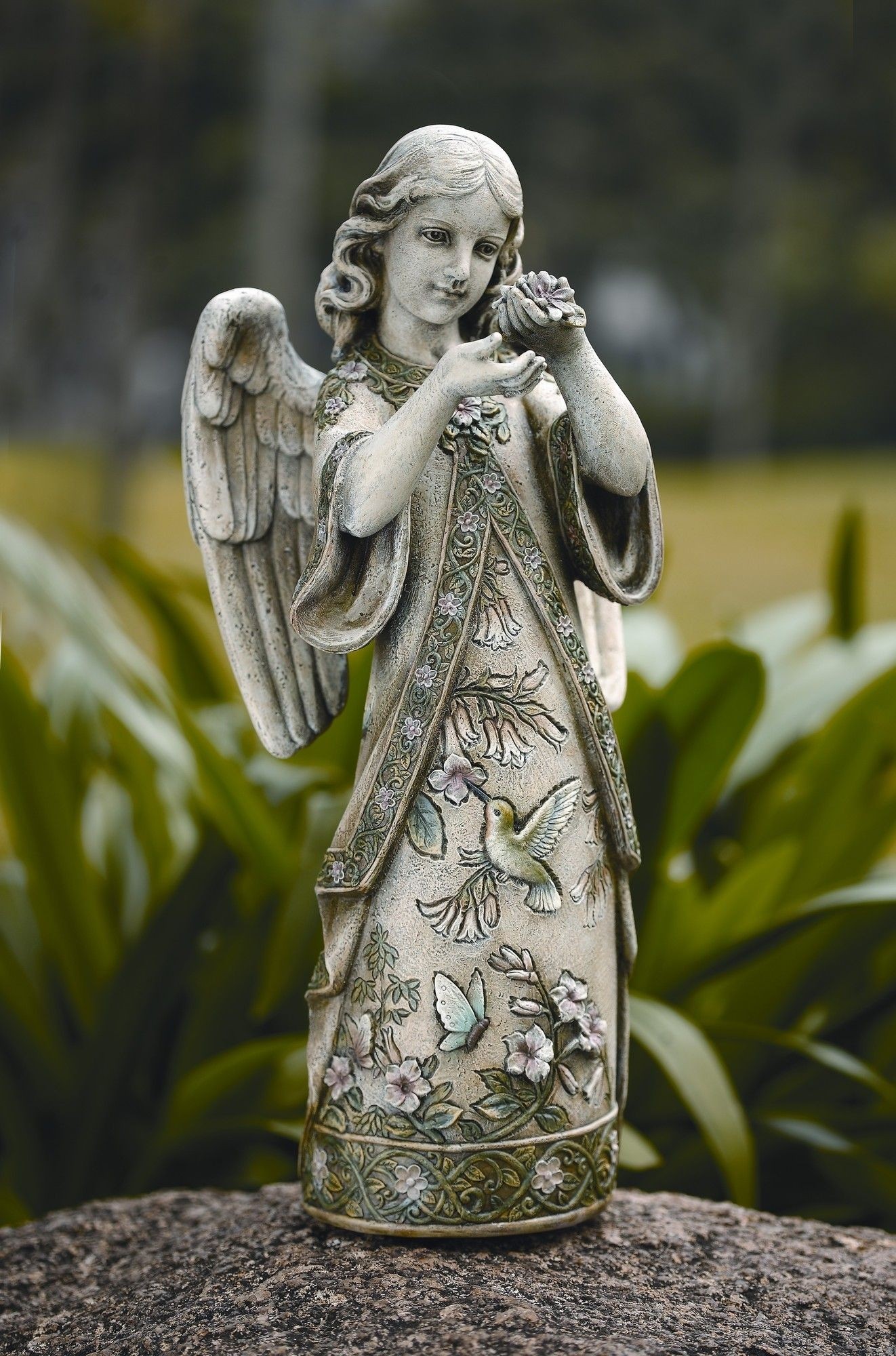 Roman garden angel with hummingbird figurine angel
