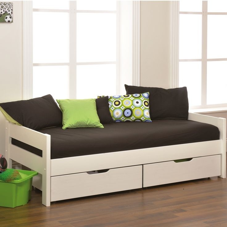 Simple white wooden daybed with low side board and two
