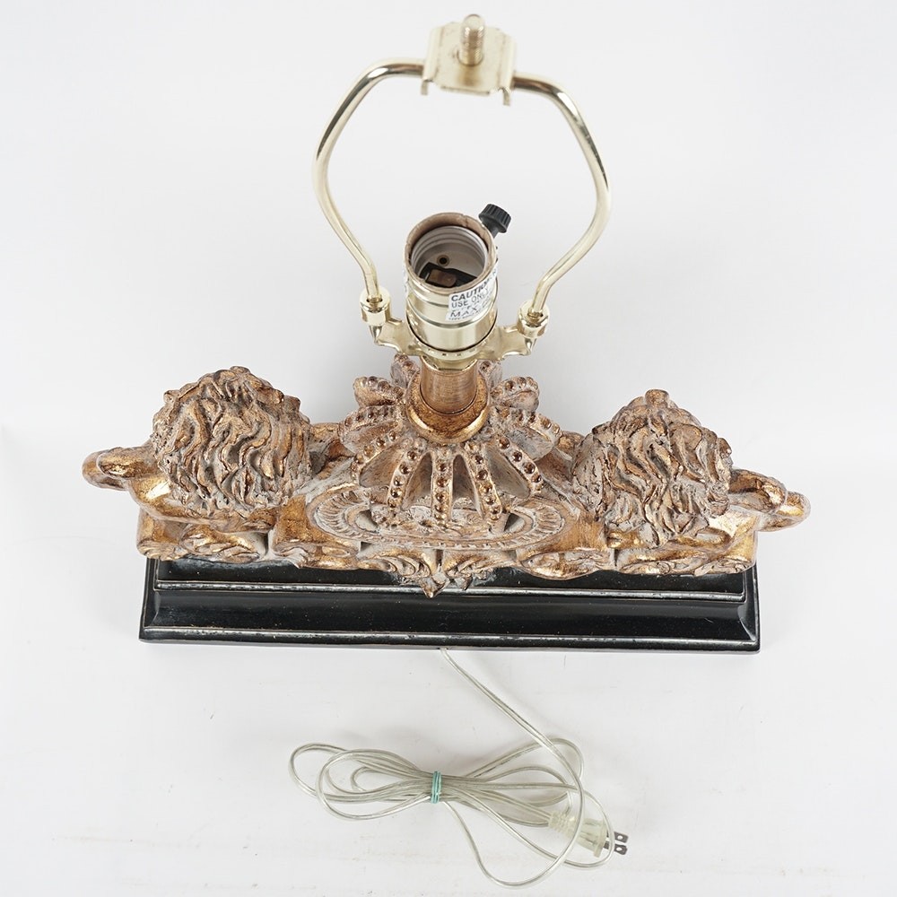 Antiqued lion crest table lamp ebth