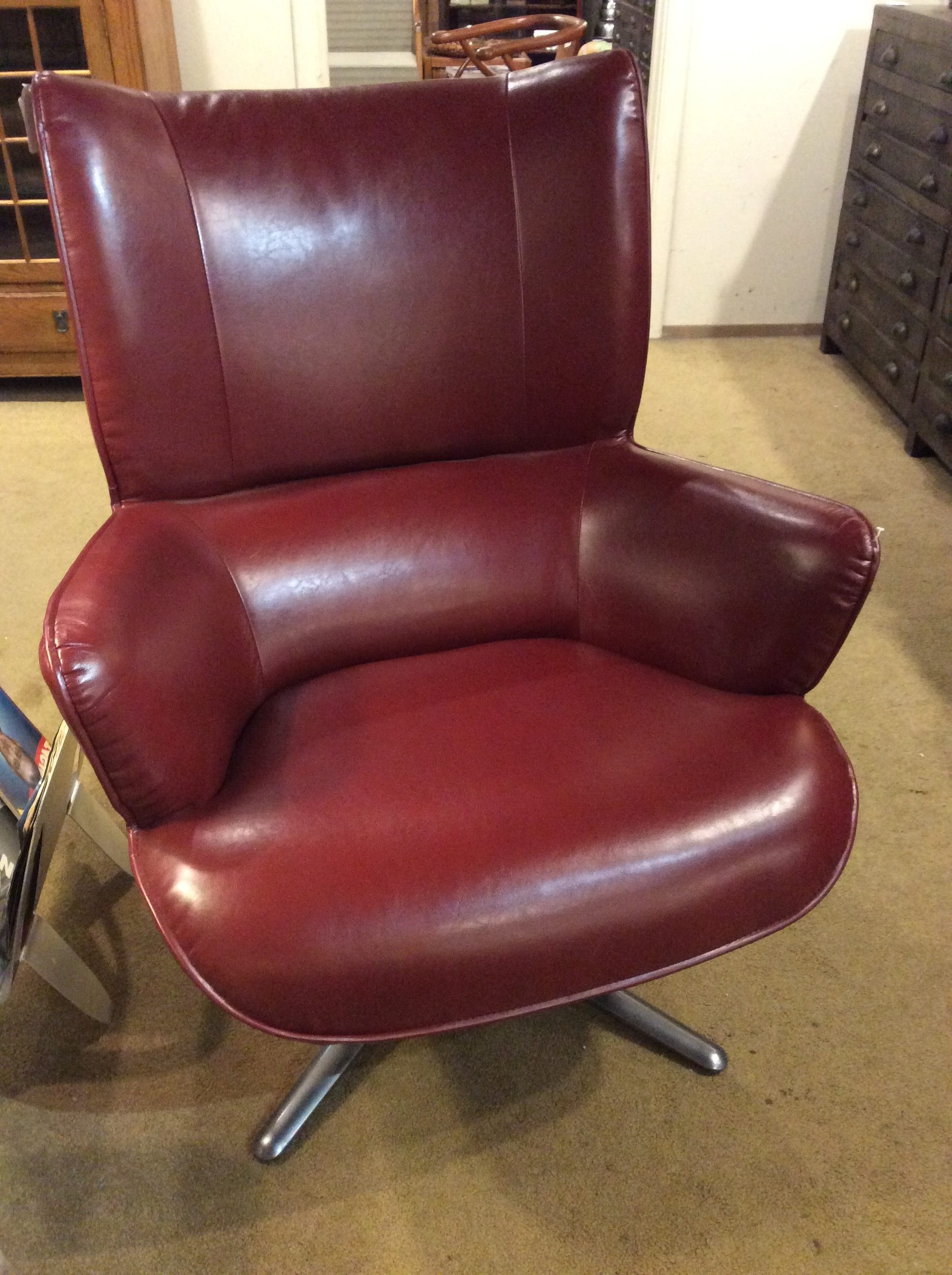 Red leather swivel chair sold ballard consignment 1