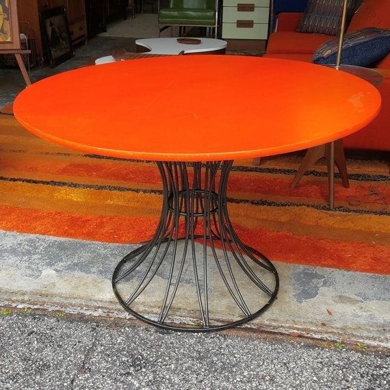 Really cool round orange top coffee table top is wood