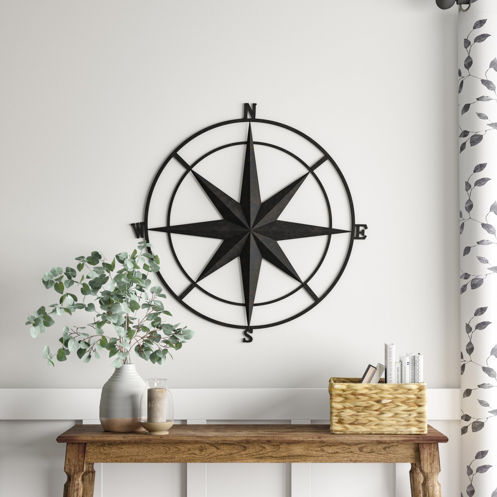 A compass themed metal circle wall art