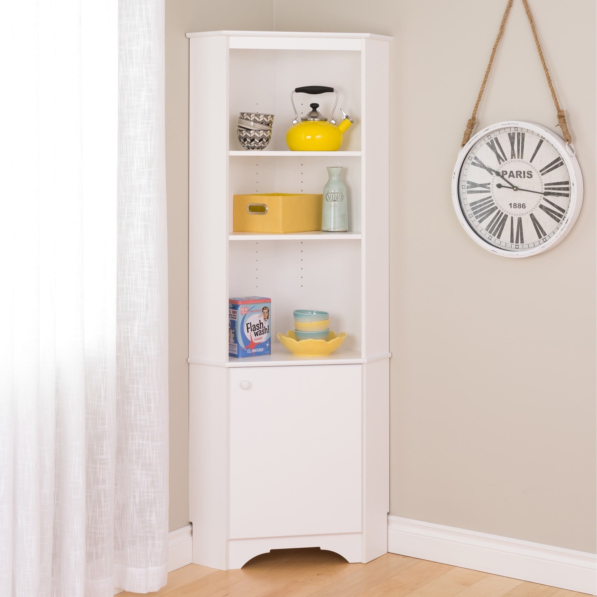 A corner dining room cabinet with white, light panels 