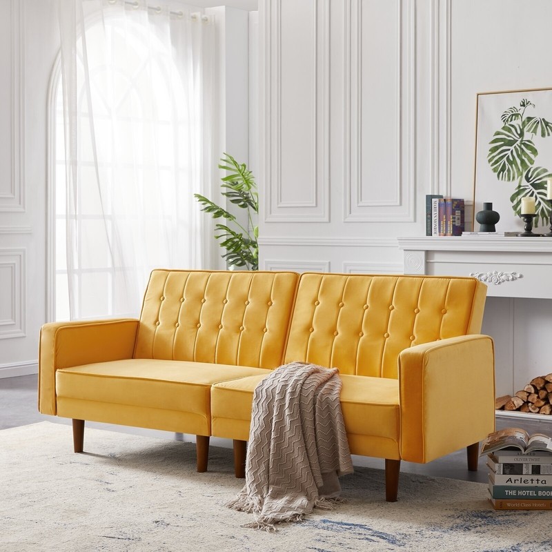 A mid century modern sofa bed in a warm accent color…