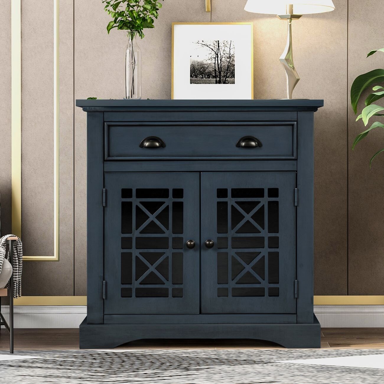 A navy cabinet with detailed, intricate, beautiful glass mosaic doors