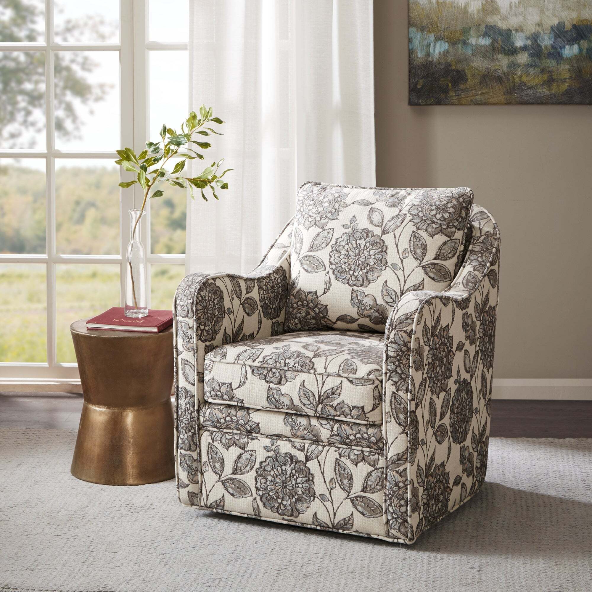 A round swivel accent chair with wide arms