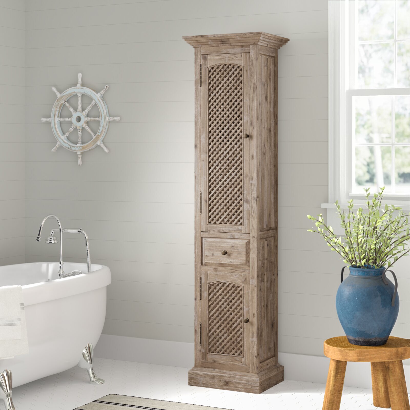 A rustic tower cabinet with lattice doors