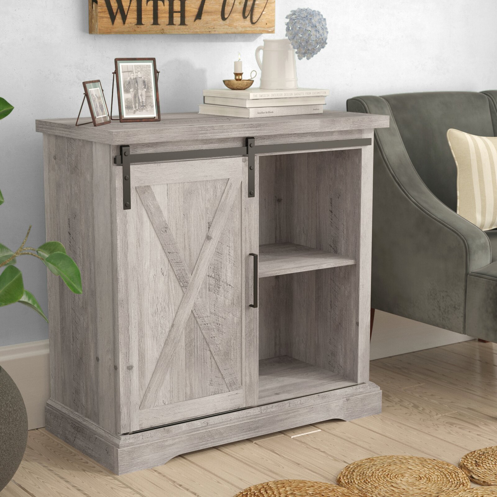 A shallow sideboard with a sliding farmhouse door