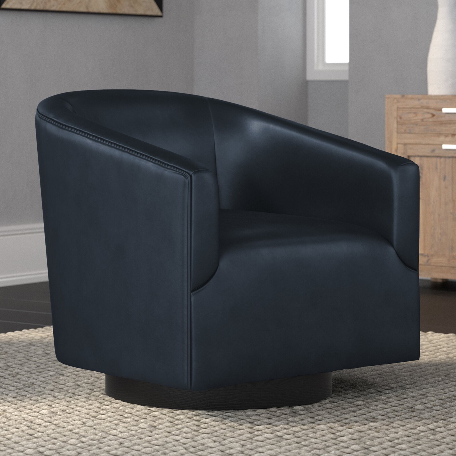 A sleek leather oversized round chair