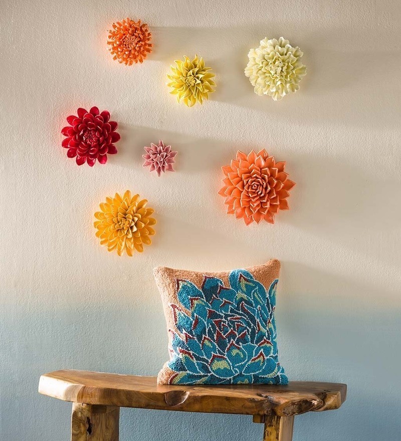 Ceramic flower wall decor in a monochrome accent color