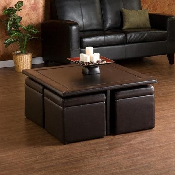 Square leather coffee table with smaller square chairs 