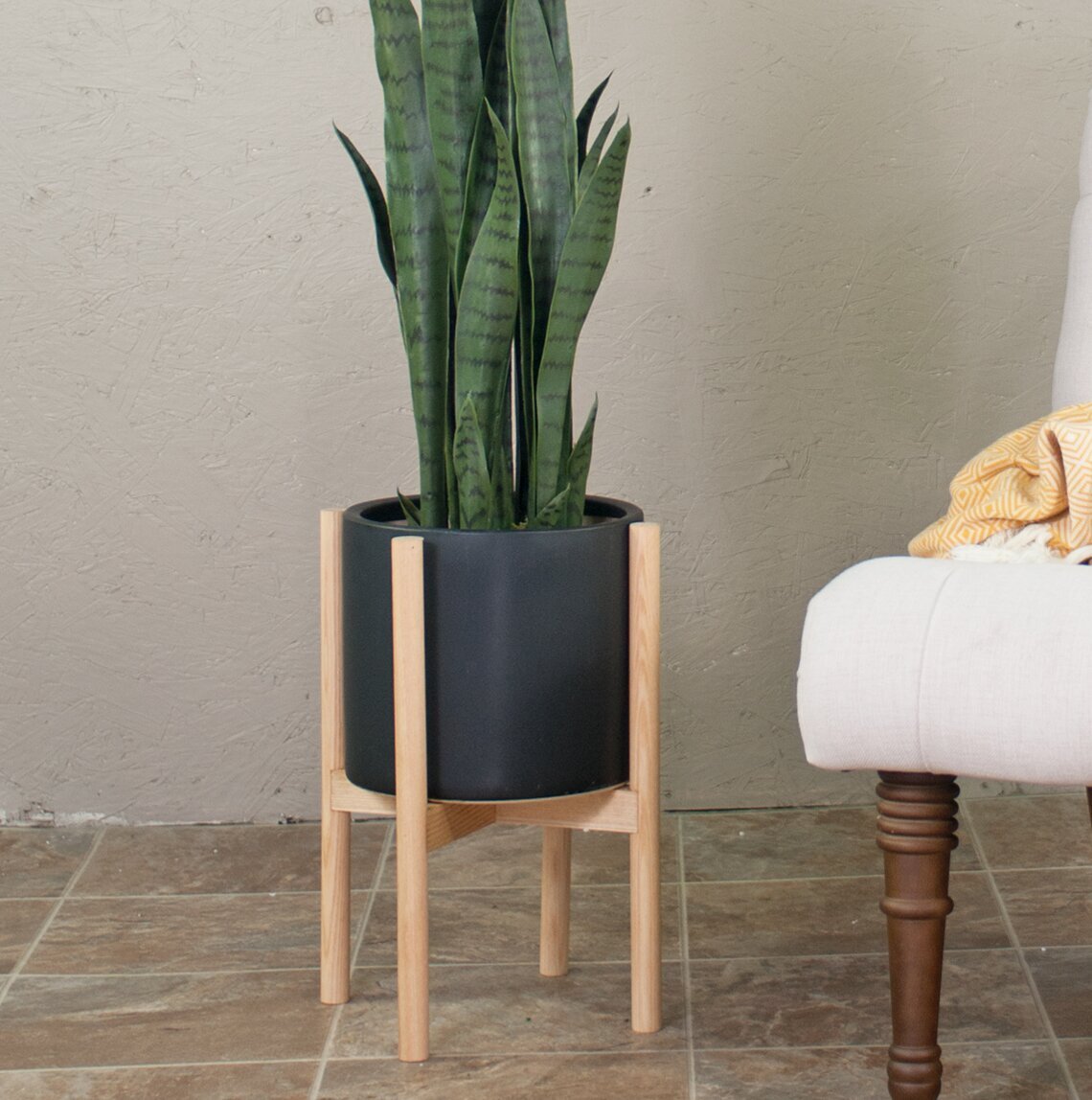 Tall ceramic planter with wooden stand