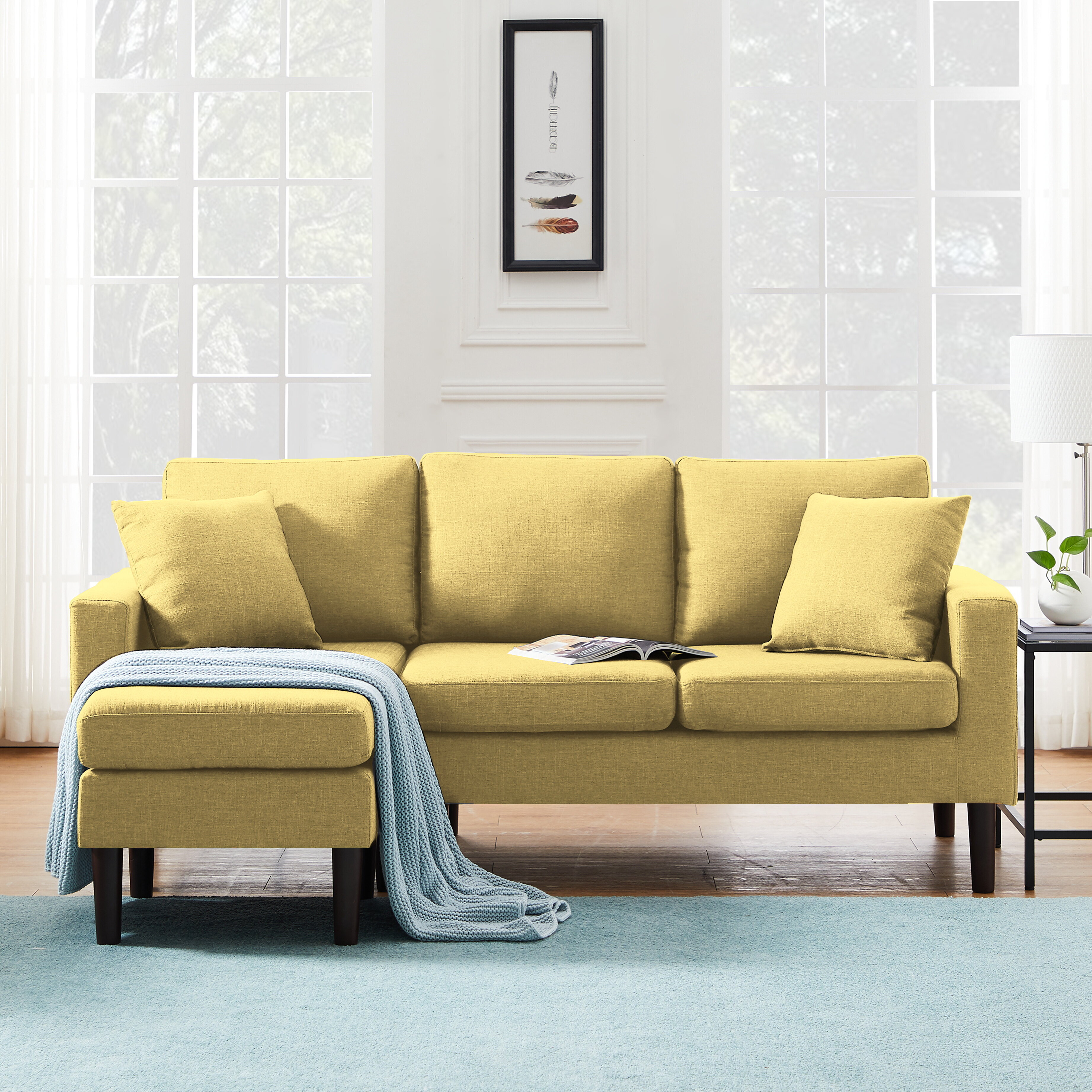 Very small couch with a solid pop of color