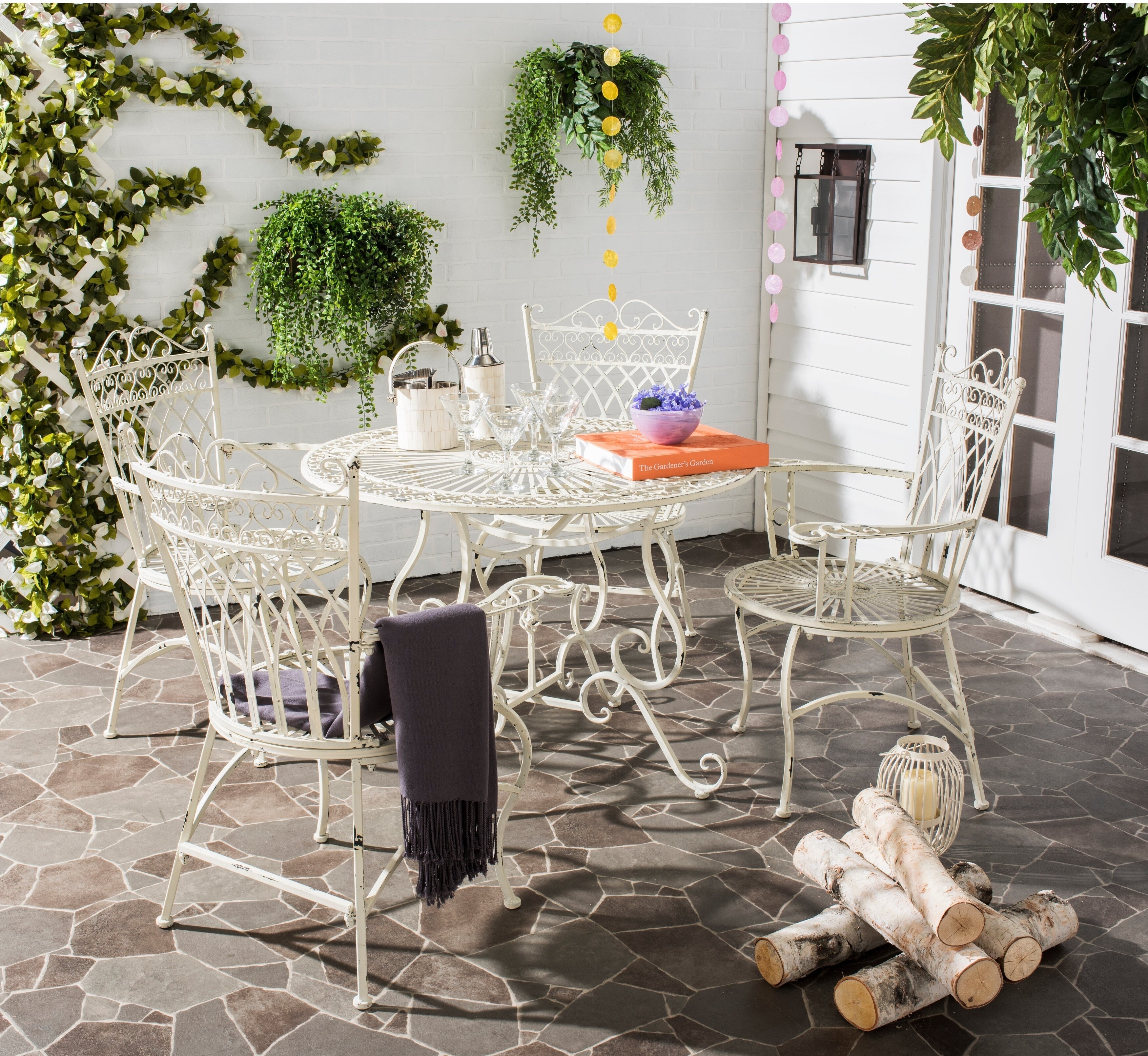 Vintage wrought iron patio furniture with a shabby chic white finish