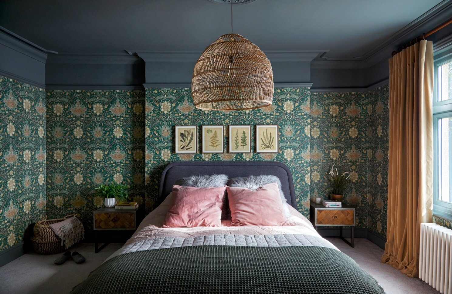 Bedroom with a patterned green wallpaper