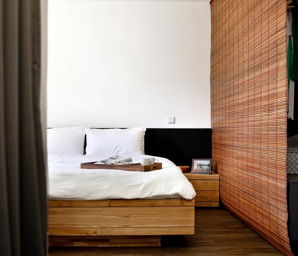 Bedroom with a white and brown palette