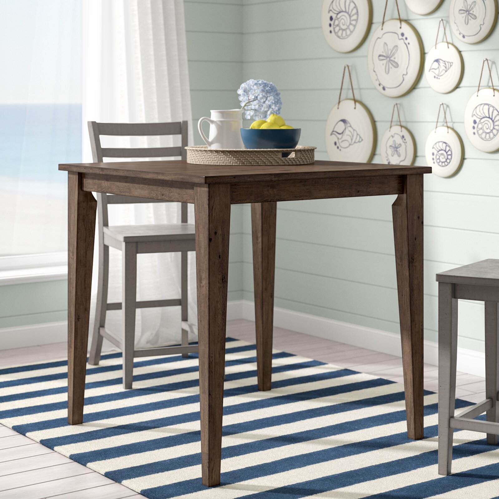 Counter height small kitchen table with coastal flair