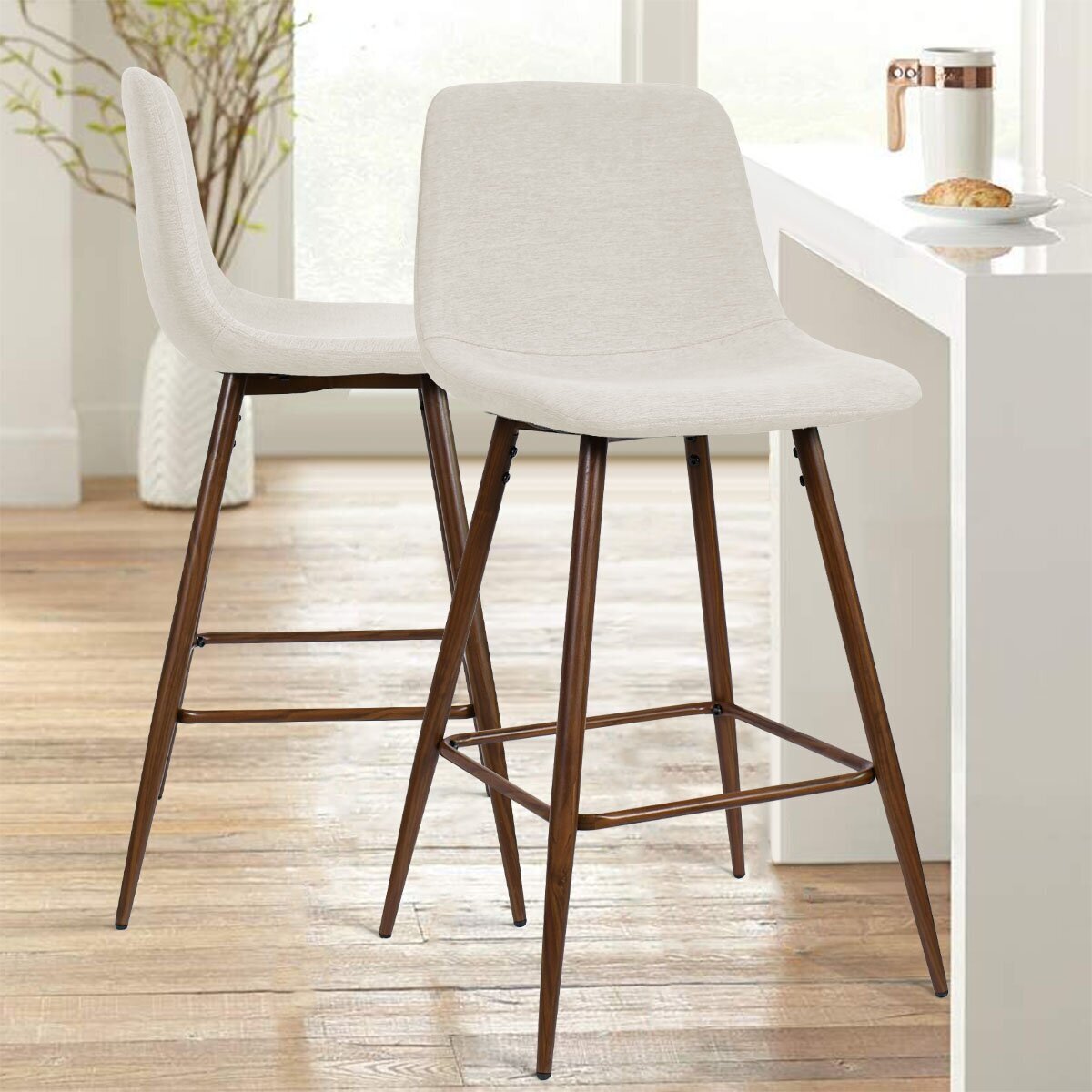 Cream upholstered bar stools in industrial style