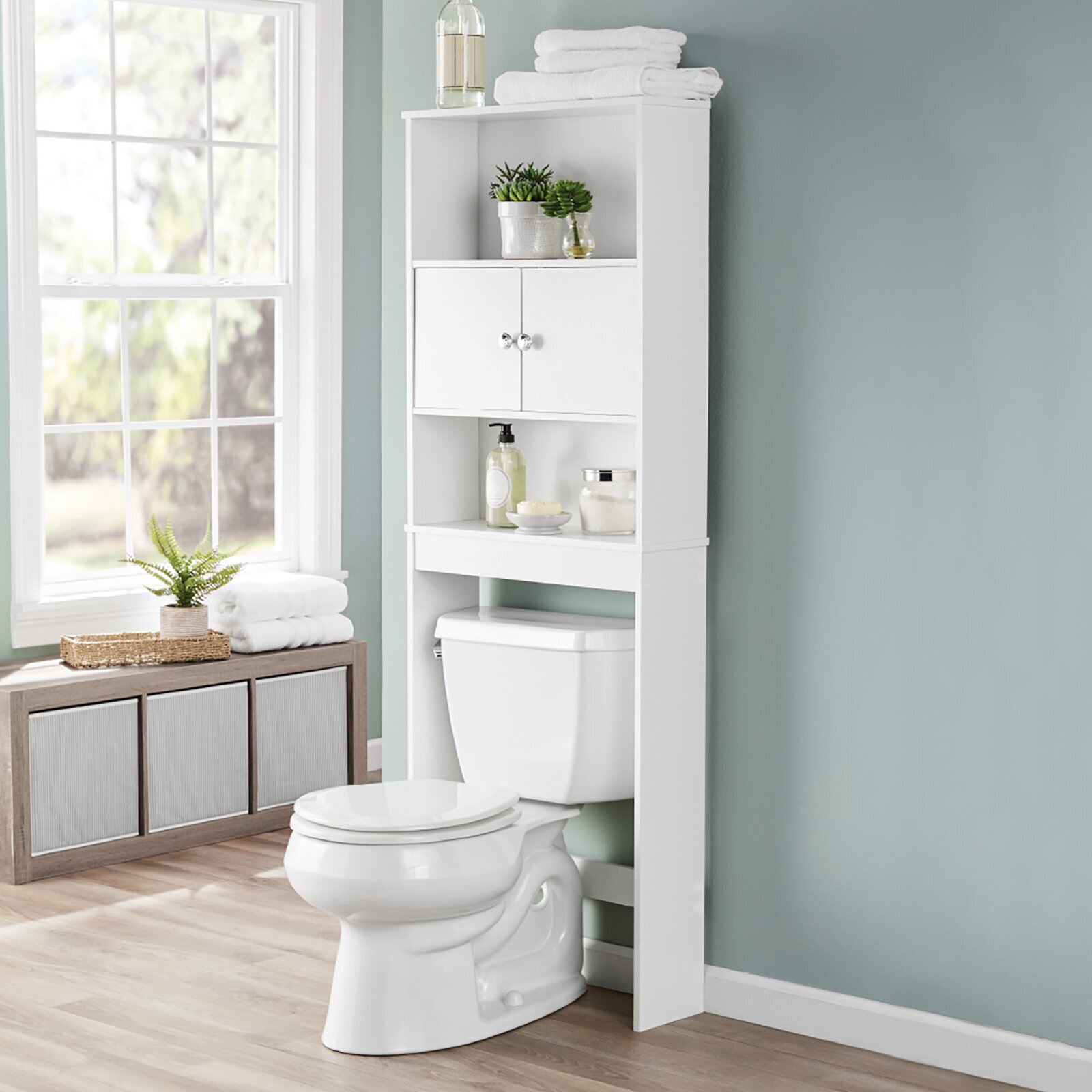 Elegant white over toilet cabinet