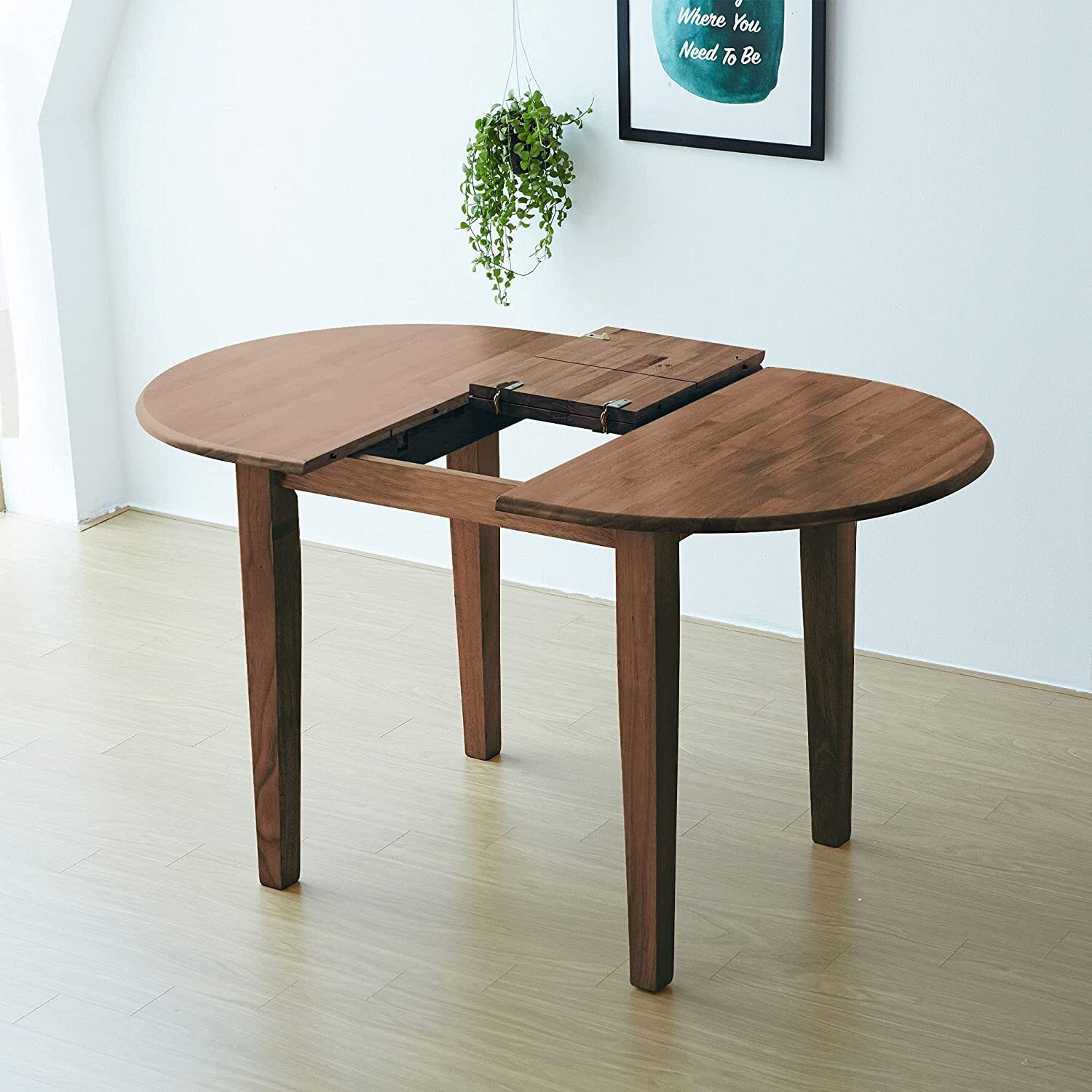 Expandable round/oval folding table in a light finish