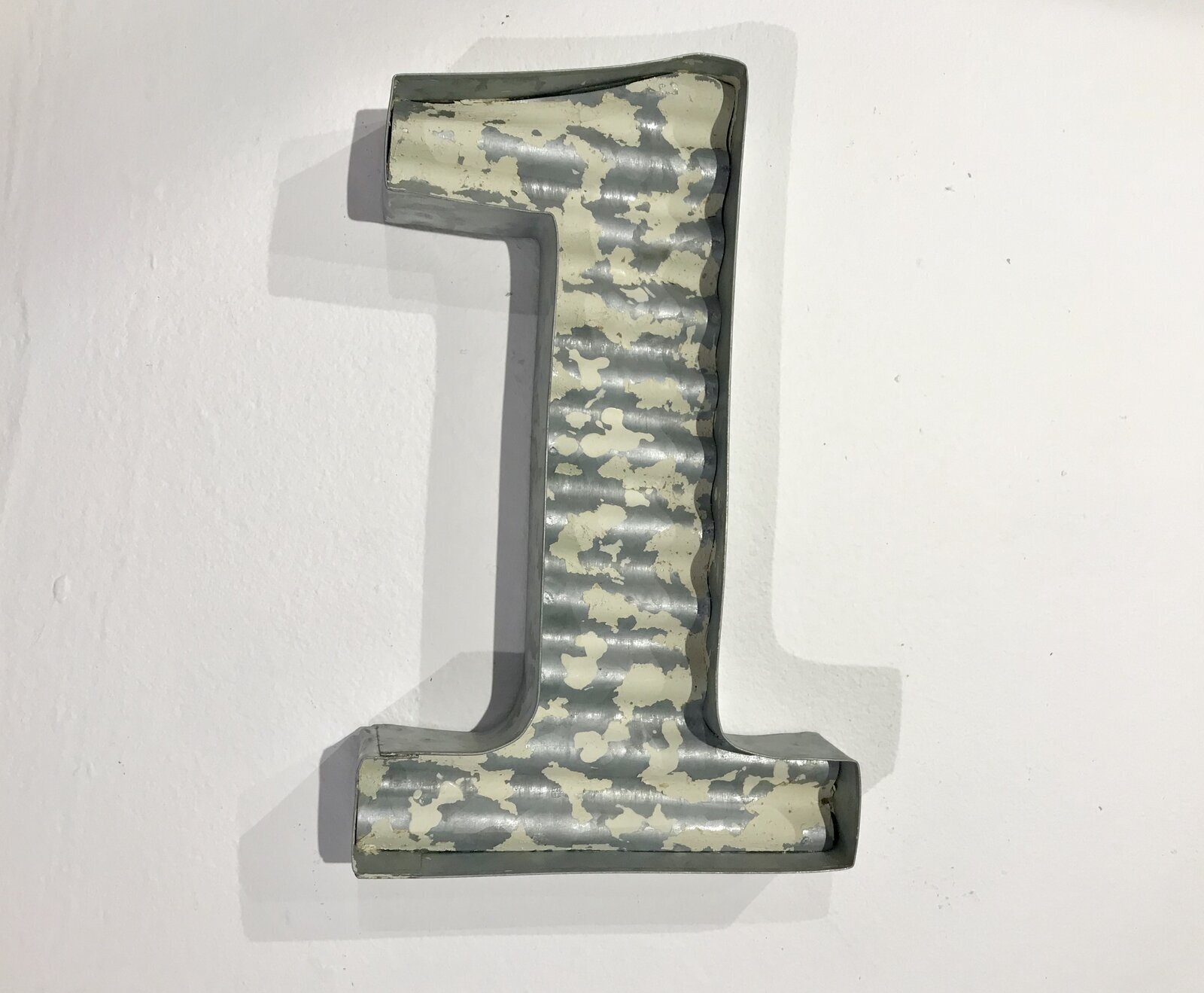 Large metal numbers in a distressed finish