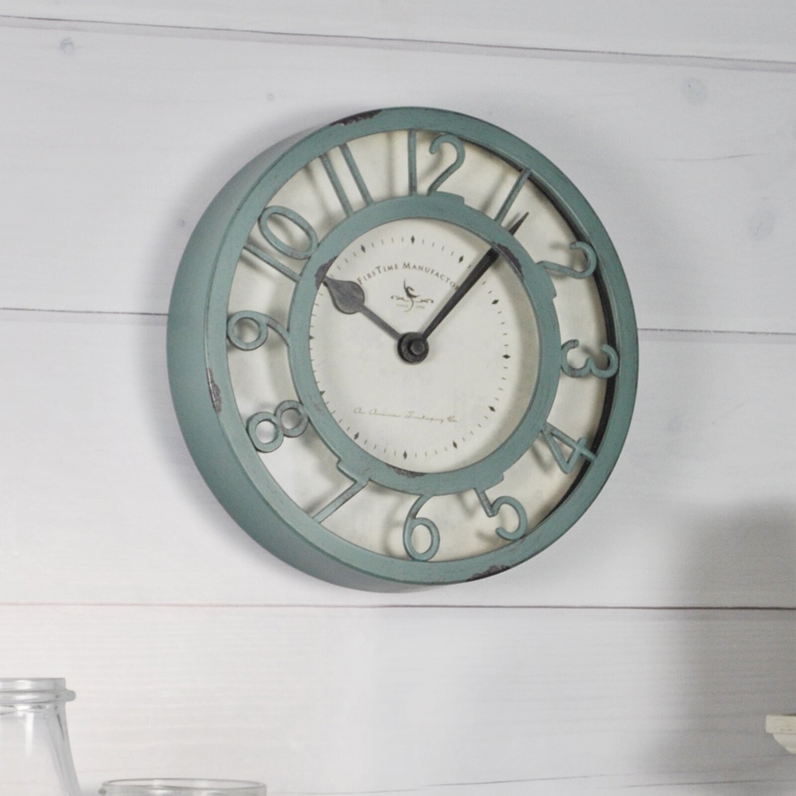 Sage green kitchen wall clock with vintage touch